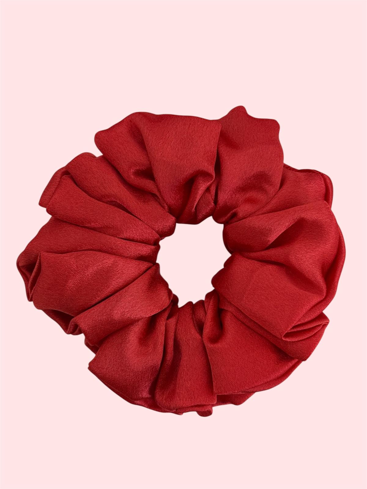 Red scrunchie on a pink background. Scarlet red satin hair scrunchie large size premium quality"
